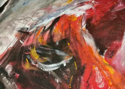 Close up photo of an Abstract Modern Acrylic Artwork done in rough lose style with bold brushstrokes, depicting a man with vibrant red skin in a wheelchair.